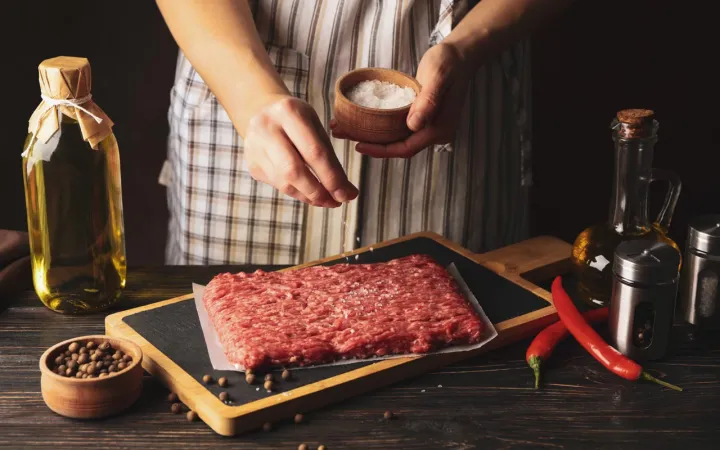 A vegetarian who cooks meat