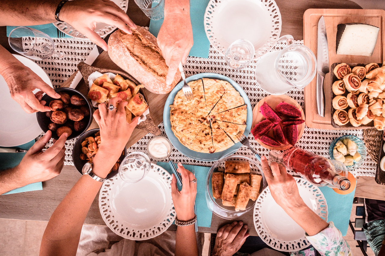 Friends and family eating Greek food