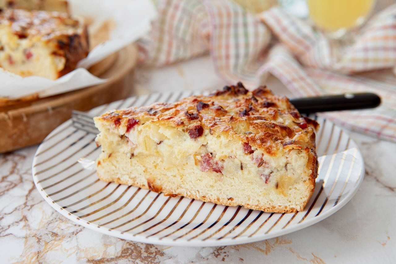 Large piece of homemade savoury cake served on a plate